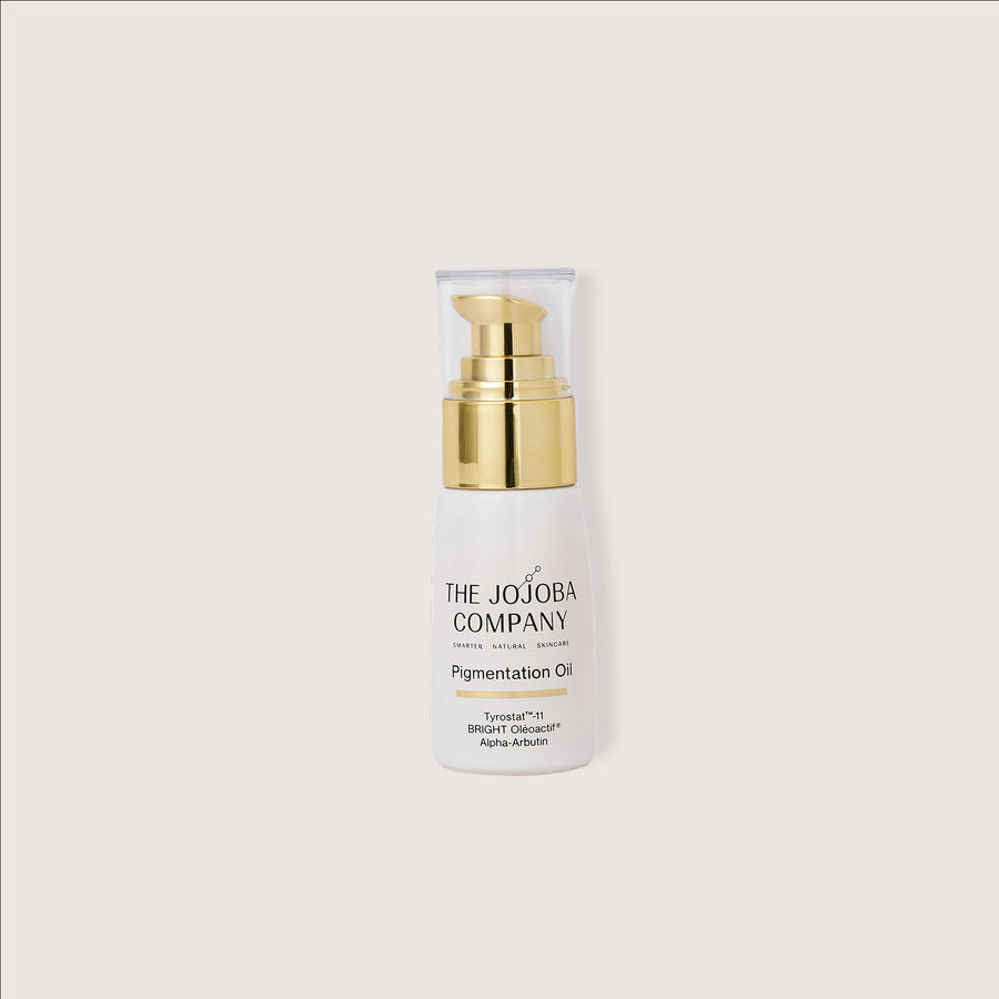 Pigmentation Oil Skincare bottle with gold cap on a white background