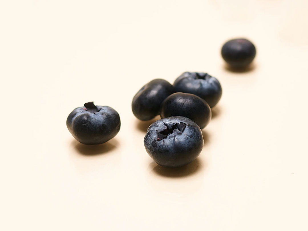 Blueberries on a pale background.