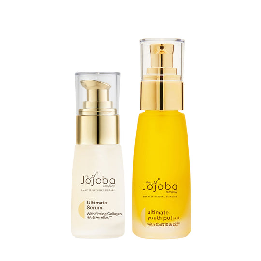 Two bottles of Jojoba skincare products, one labeled 'Ultimate Serum', the other 'Ultimate Youth Potion'.