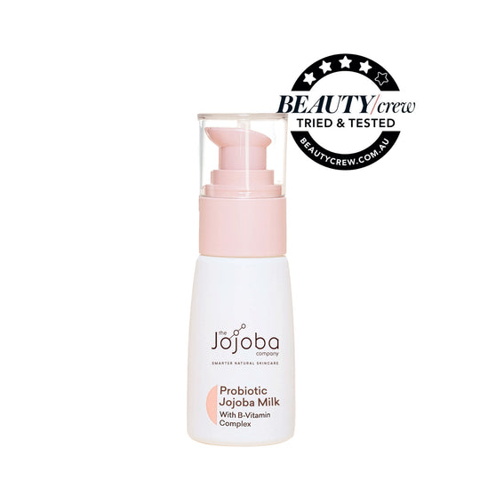 A bottle of Jojoba Company Probiotic Jojoba Milk skincare with a "Beauty Crew Tried & Tested" badge.