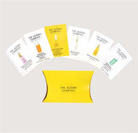 Set of The Jojoba Company product packaging on a light gray background